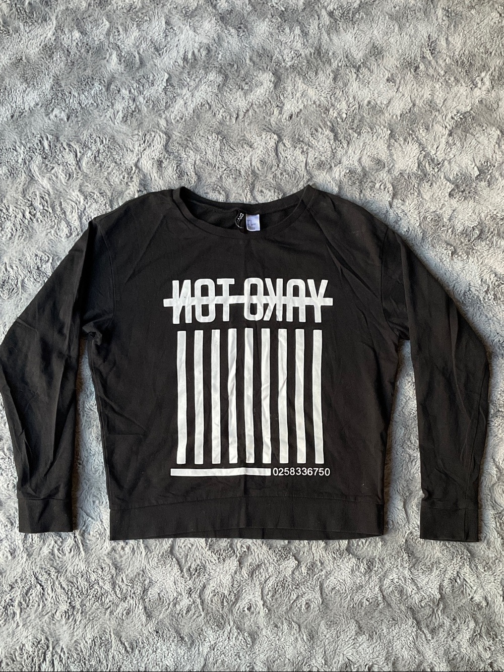 Divided Black Crewneck Sweatshirt with White 'NOT OKAY' Graphic